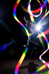 Image showing Skateboarder with Abstract Light Trails