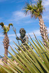 Image showing King Neptune Statue and Tropical Foliage