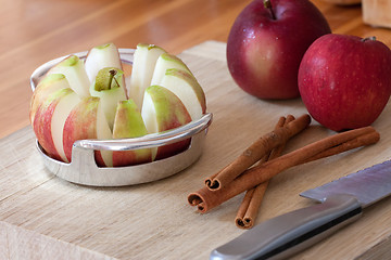 Image showing Apple Slicer and Cinnamon Sticks