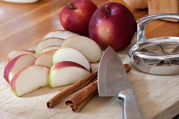 Image showing Sliced Apple and Cinnamon Sticks