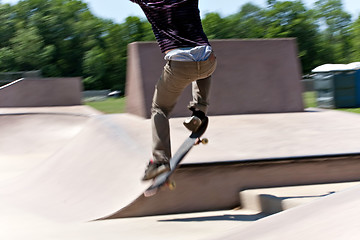 Image showing Skater Jumping at the Concrete Skate Park