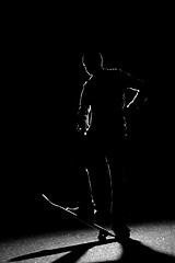 Image showing Back Lit Skateboarder Silhouette