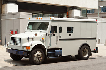 Image showing Armoured Armored Car Parked on Street Building