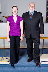 Image showing White Senior Man and Young Woman Church Goers at Altar