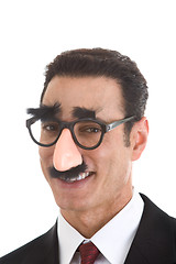 Image showing Smiling Businessman Wearing Groucho Marx Glasses Isolated on Whi