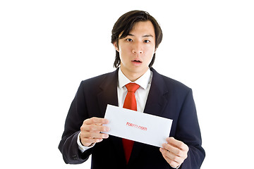 Image showing Shocked Asian Man Suit Holding Foreclosure Notice