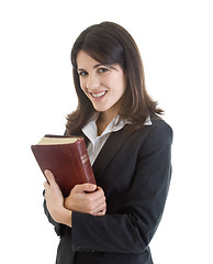 Image showing Smiling Woman Holding Bible Closely Isolated White