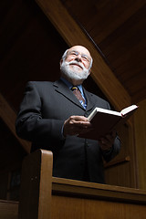 Image showing Senior Caucasian Man Standing Church Pew Hymnal