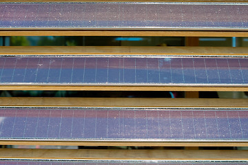 Image showing Row of Dusty Louvered Solar Panels