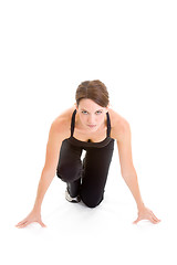 Image showing Woman Runners Crouch, Ready to Sprint, Isolated