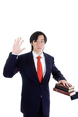 Image showing Asian Man Swearing on a Stack of Bibles Isolated White