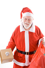 Image showing Happy Santa Holding Present and Sack Isolated 