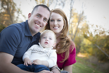 Image showing Young Attractive Parents and Child Portrait Outside