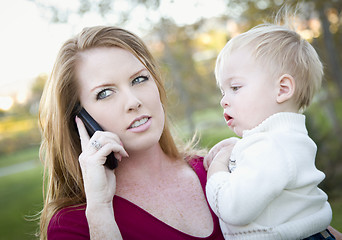 Image showing Attractive Woman Using Cell Phone with Child