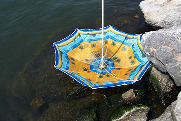 Image showing umbrella in river