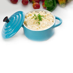 Image showing mac and cheese on a blue little clay pot