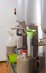 Image showing Filling olive oil