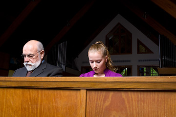 Image showing Senior Man Young Woman Sitting Head Bowed Praying Church Pew 