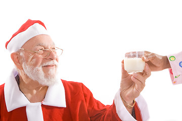 Image showing Santa Taking Glass of Milk From Hand Isolated