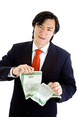 Image showing Upset Asian Man Suit Tearing Stock Certificate