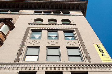 Image showing Old Beige Brick Building For Lease Sign, USA