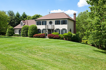 Image showing Front Suburban Single Family House Hillside French