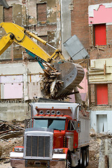 Image showing Front End Loader Dropping Scrap Materials Truck