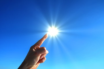 Image showing hand sun and blue sky