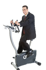 Image showing Happy Caucasian Man Suit on Exercise Bike Isolated White Backgro