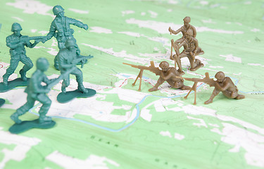 Image showing Plastic Army Men Fighting on Topographic Map Two Armies Battle