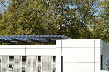 Image showing Modern Solar Home with Row PV Panels on Roof 