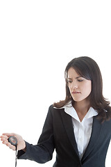 Image showing Caucasian Woman Biting Lip Looking at Compass Isolated on White