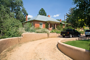 Image showing Brick Home Santa Fe, New Mexico Gravel Drive Adobe Wall