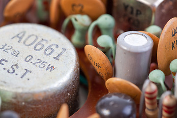 Image showing Old Metal Plastic Transistors Inside Transistor Radio Macro Clos