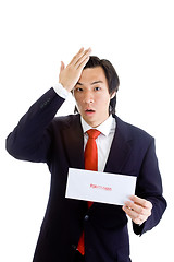 Image showing Shocked Asian Man Hand On Head, Foreclosure Notice