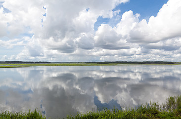 Image showing Dramatic Puffy White Clouds Reflected Smooth May River Bluffton 