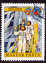 Image showing Stamp Waving Astronauts Launch Tower Space Suit