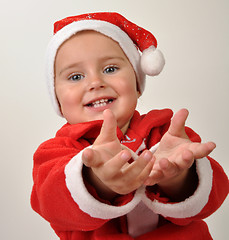 Image showing cute little smiling Santa toddler girl