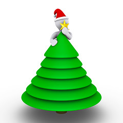 Image showing Placing the star on the Christmas tree