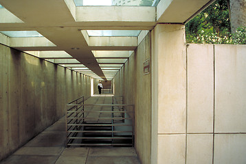 Image showing Man in business suit walking in underground tunnel