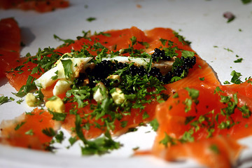 Image showing Sashimi salmon with boiled egg, caviar, and parsley