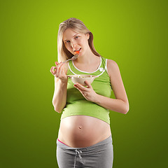 Image showing tender pregnant female with salad