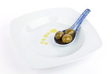 Image showing Olives on  spoon.