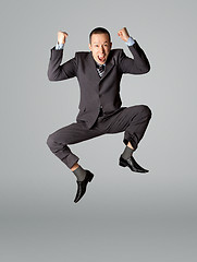 Image showing Happy businessman jumping