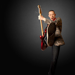 Image showing rocker with guitar and foot