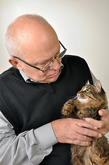 Image showing senior man with a cat