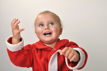 Image showing smiling Santa toddler girl