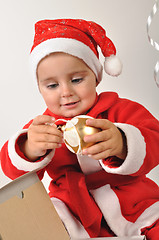 Image showing smiling Santa toddler girl