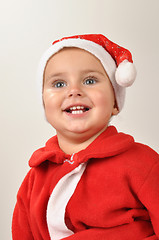 Image showing smiling Santa toddler girl