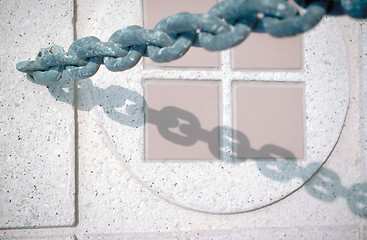 Image showing Chain and ceramic tile detail